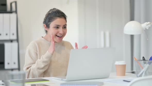 Indian Woman with Laptop Celebrating Success