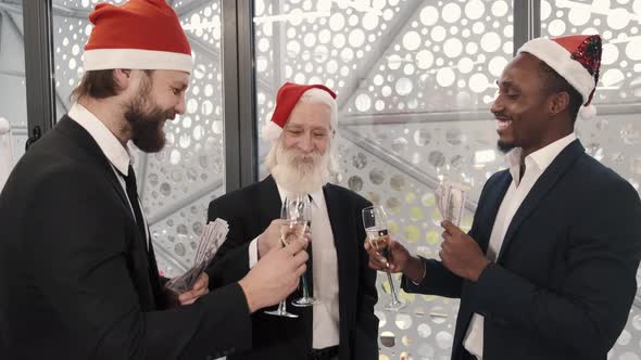 Male Business Colleagues with Glasses of Champagne Having Celebration at Office Party