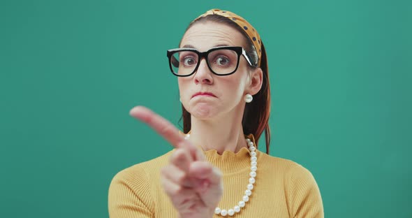 Funny sixties style woman waving finger to reject. No gesture. Isolated.