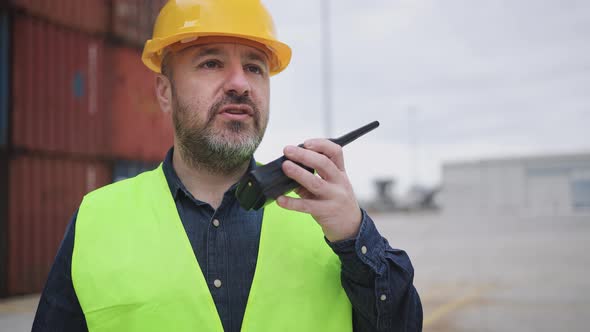 Industrial engineer working in logistic terminal of container cargo