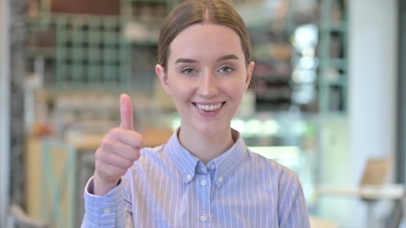 Portrait of Thumbs Up By Optimistic Young Businesswoman