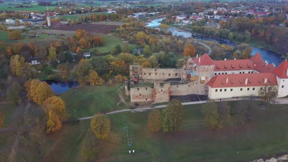 Bauska Medieval Castle Ruins Complex and Park From Above Aerial Shot 4K Video