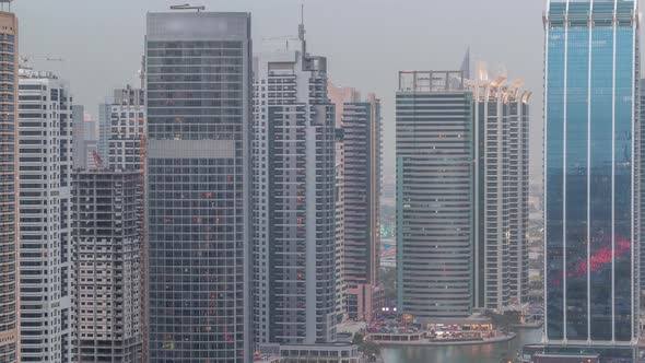 Residential and Office Buildings in Jumeirah Lake Towers District Day to Night Timelapse in Dubai