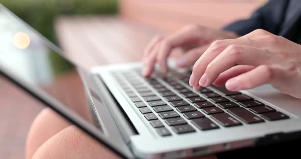 Close up of typing on notebook computer