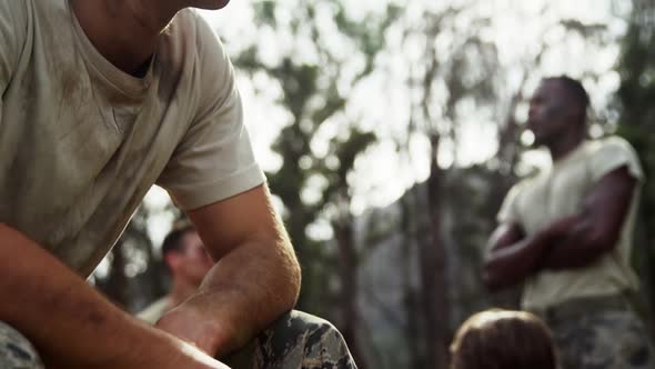 Military soldier relaxing at boot camp 4k