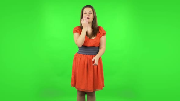 Cute Girl Smiling and Showing Heart with Fingers Then Blowing Kiss. Green Screen