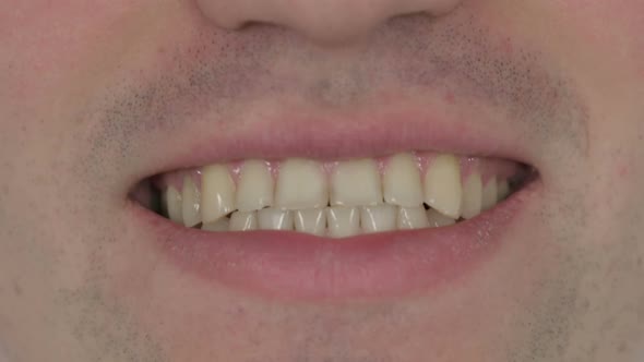 Close Up of Male Smiling Lips