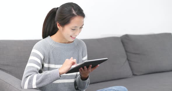 Woman use of tablet computer at home