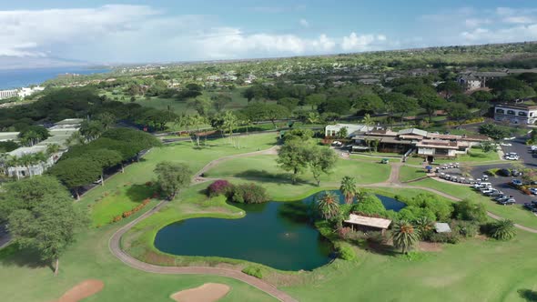 Aerial View of Golf Club Building and Lake on Perfect Green Field Prestige Game