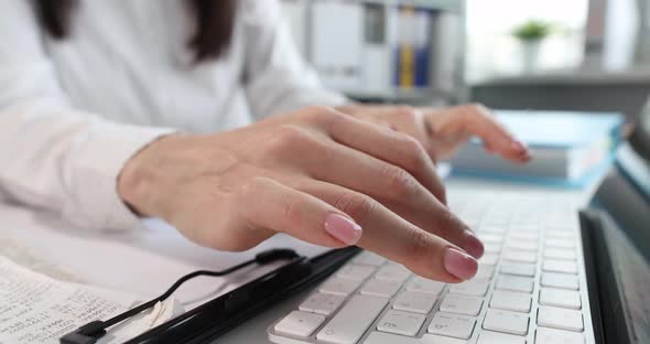 Female Office Worker Typing on Keyboard Closeup