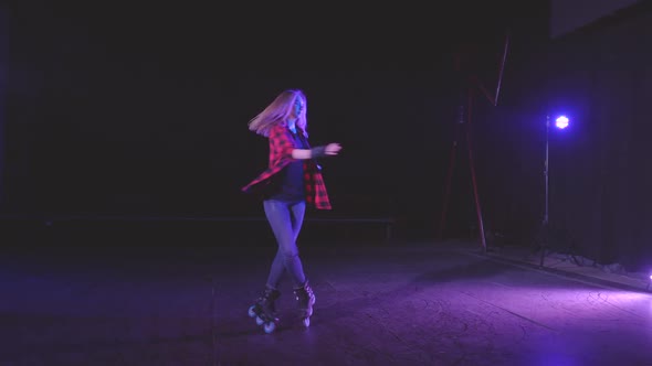 Charming European Smiling Girl on Roller Skates Performs Various Turns and Elements, Skating in