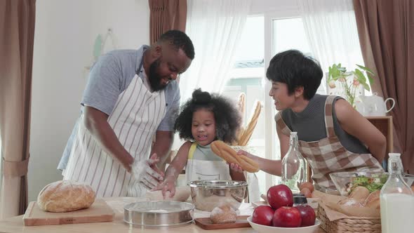 Active African American family in love having fun preparing lunch on a weekend