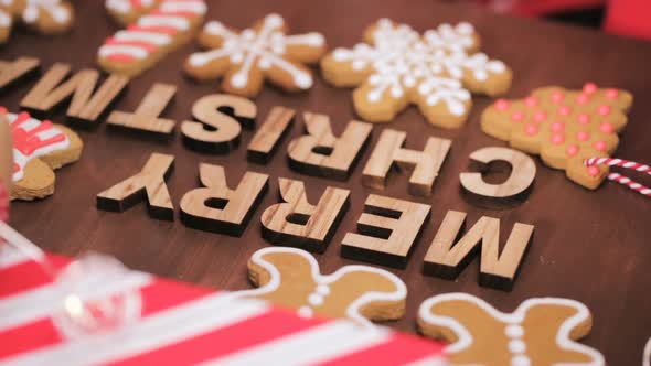 Wood Merry Christmas sign and traditional gingerbread cookies home made.