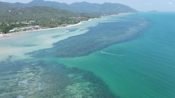 Kitesurfing In Idyllic Beach Of Ko Pha Ngan Island In Southeast Thailand