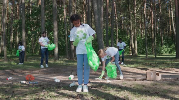 Ecoactivists Clean Up Garbage in the Forest Fight Against Plastic Pollution of Nature People of