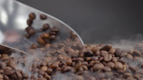 Ladle Scooping Up Coffee Beans Close Up