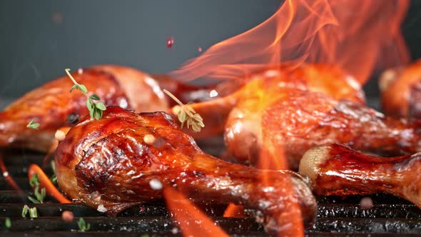 Super Slow Motion Shot of Seasoning Falling on Fresh Grilled Chicken Legs at 1000 Fps