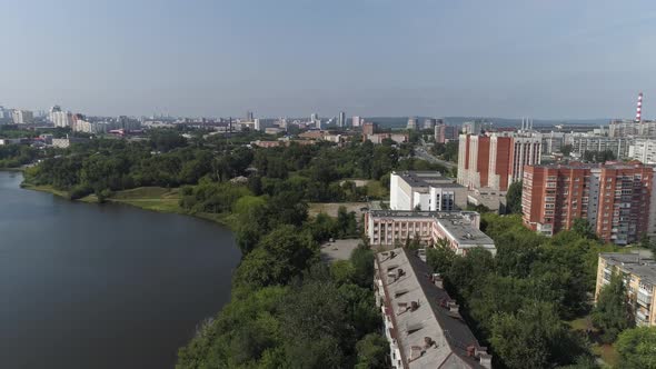Old Soviet Russian high-rise houses next to the river. 11