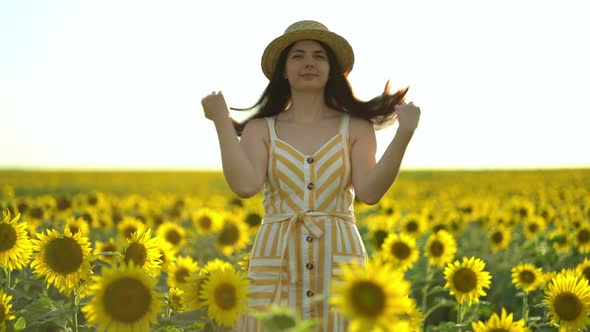 Girl Throws a Straw Hat at the Camera