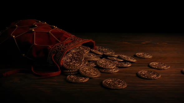 Gold Coins In Bag In Firelight