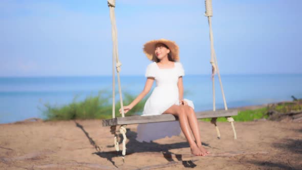 Asian woman enjoy around beautiful beach sea ocean