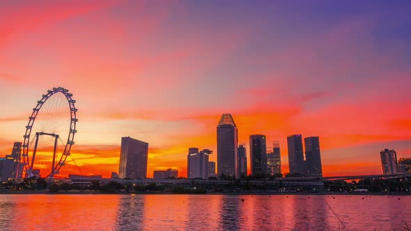 Sunset over Singapore and Ferris Wheel