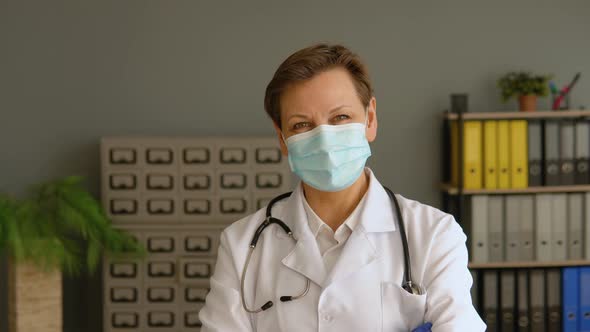 Portrait of a Senior Female Doctor in Protective Mask