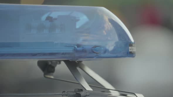 Flashing Flasher on the Roof of a Police Car. Blinker. Close-up.