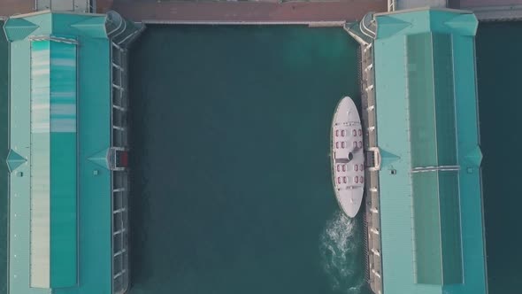 Hong Kong star ferry, central terminal and harbour front. Top down aerial drone view