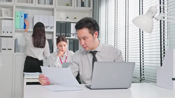 Group of Asian attractive business people use laptop computer working in office workplace.