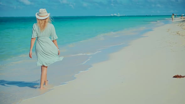 Tanned Woman In Dress. Relaxing On Zanzibar Kiwengwa. Have Great Time On Sea Trip. Ocean Relaxing.