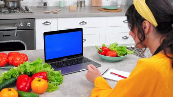 Blue Screen Laptop Woman Watch Online Cooking Course Webinar Tells Teacher Chef