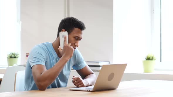 Phone Talk, Young Black Man at Work