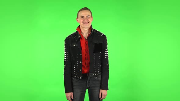 Guy Smiles Broadly and Winks . Green Screen