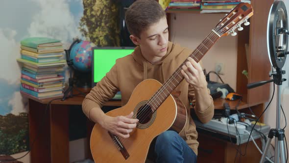 Guy Playing Guitar