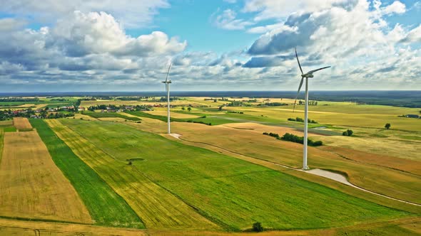 Wind turbines on green field in Poland, aerial view