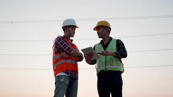 Asian engineer, foreman or leader inspection by tablet at power plant