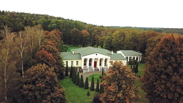 Aerial view of a beautiful architectural building with green roof in the park.