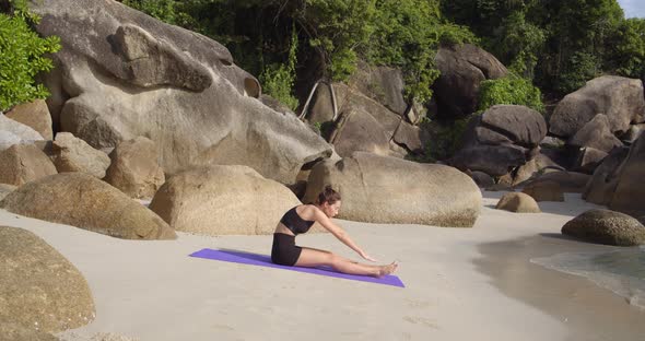 Mid Shot of Female Making Yoga Practice at Sand Beach