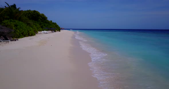 Wide angle above abstract shot of a paradise sunny white sand beach and aqua blue water background i