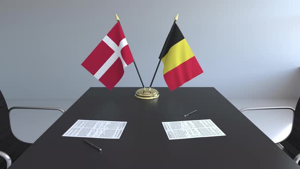 Flags of Denmark and Belgium on the Table alt