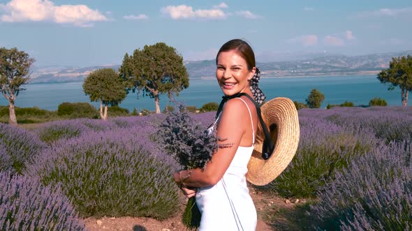 Female Walking in Lavender Field