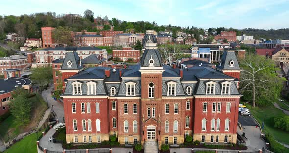 West Virginia University, WVU Woodburn Hall. Rising aerial reveal at golden hour. Public land grant