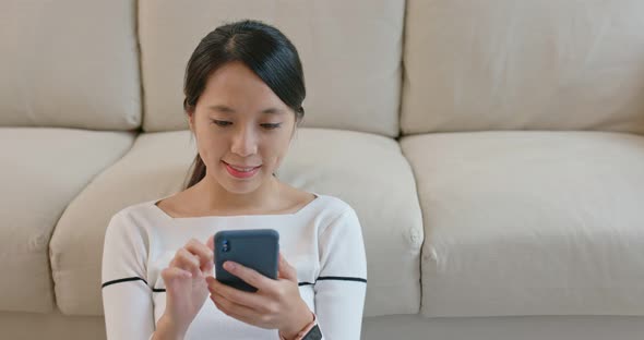 Woman use cellphone at home