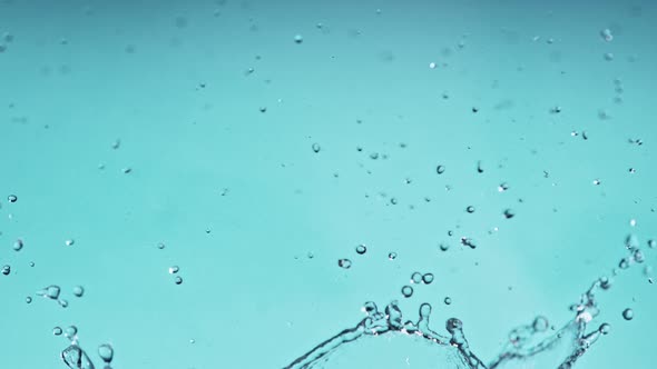 Super Slow Motion Shot of Water Splash at 1000Fps on Blue Gradient Background