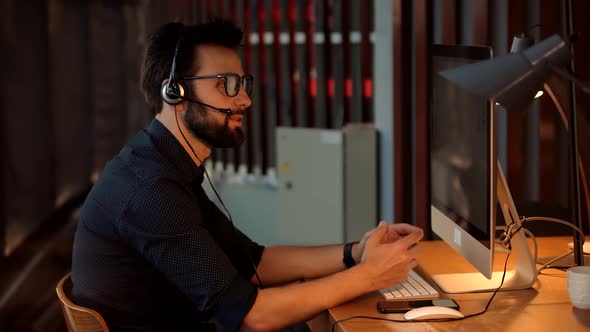 Businessman Working Alone. Man Working In Modern Office At Night On Computer. Graphic Designer.