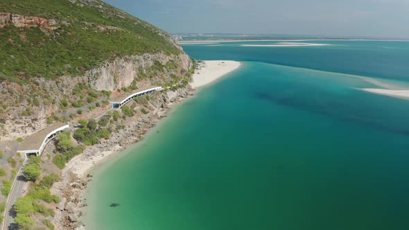 A Seafront Cliff Surrounded with a Sparkling Blue Harbor alt