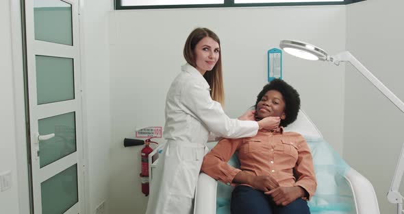 Female Patient African American At Hospital Reception Sitting In Cosmetologist's