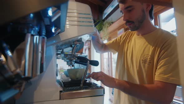 Barista Prepares Coffee in a Cafe