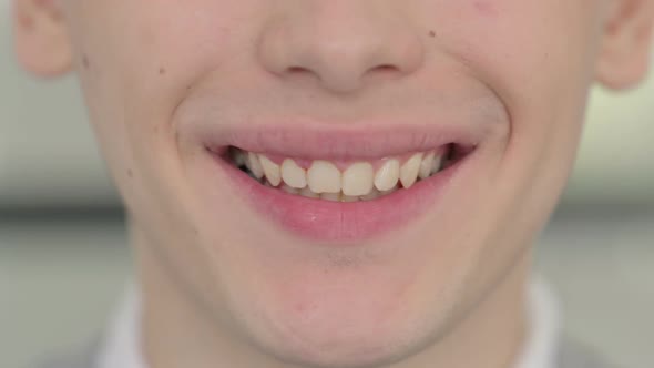 Close Up of Smiling Mouth of Young Man